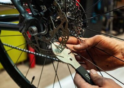 Cycle wheel being repaired by a technician during a Bike Repair Los Angeles service.